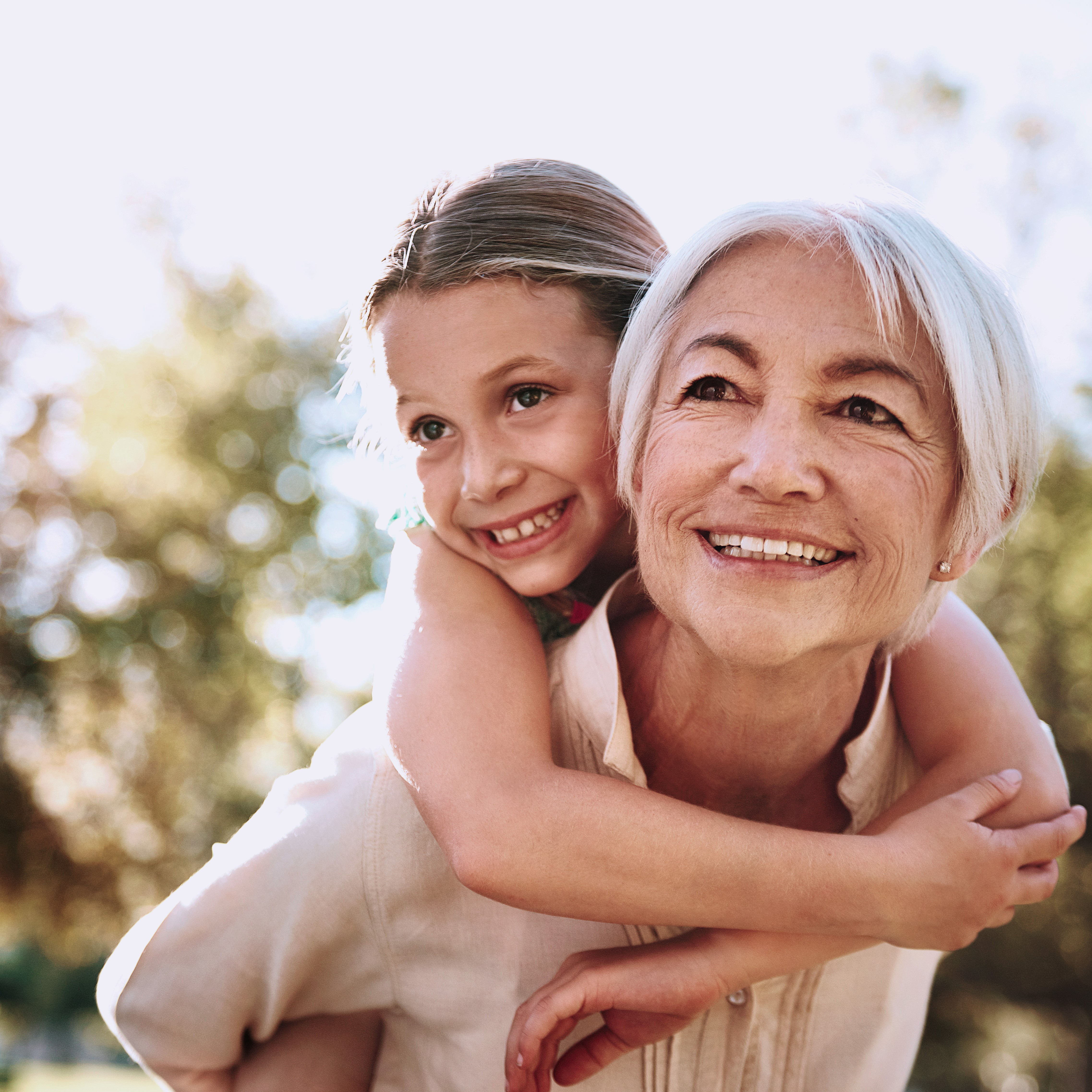 Older woman carrying a child